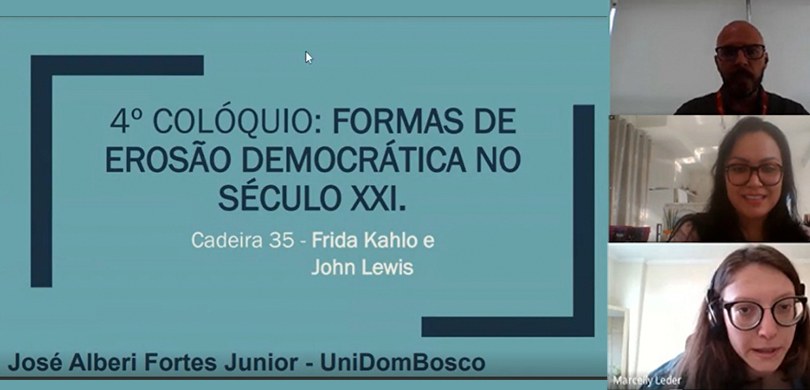 Print de uma reunião por videoconferência. Três pessoas aparecem com as câmeras abertas, sendo d...