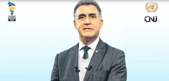 LIODS do TRE-PR participa do II Encontro Ibero-Americano da Agenda 2030 no Poder Judiciário Reprodução de um frame de vídeo em fundo branco, com um senhor de terno e gravata ao centro, em ...