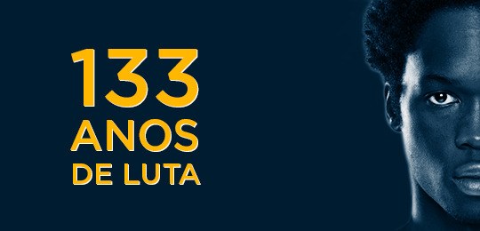 No aniversário da Lei Áurea, diversidade racial é pauta no Judiciário Imagem de fundo azul. À direita, metade do rosto de um homem negro. À esquerda, escrito em letra...