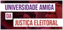 Banner nas cores roxo, rosa e vermelho, intitulado "Universidade Amiga da Justiça Eleitoral". Ao...