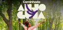 Banner em que se lê: Caminhada Anjo Guia - Curitiba. Ao fundo, há uma fotografia de uma mulher n...